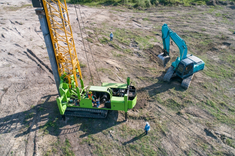 an aerial view of a construction site with a crane
