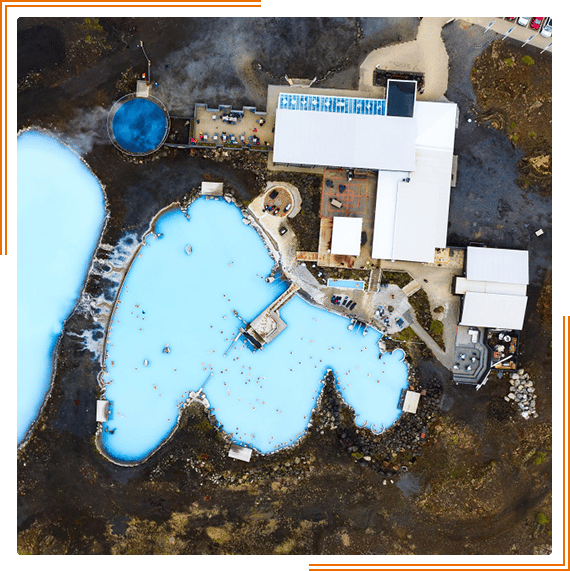 an aerial view of a large blue pool