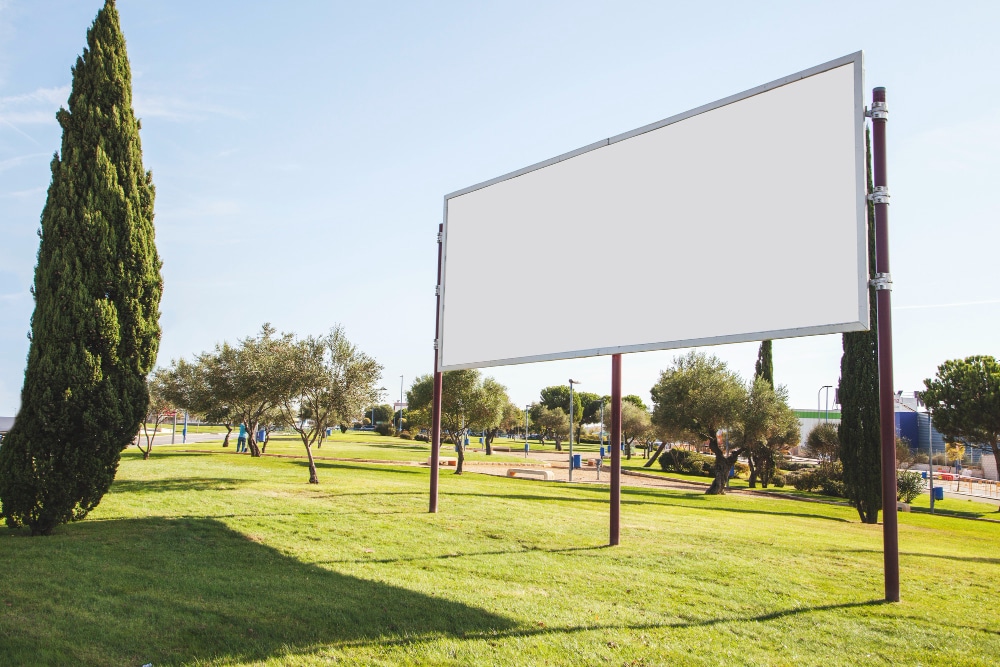 an empty billboard in the middle of a park