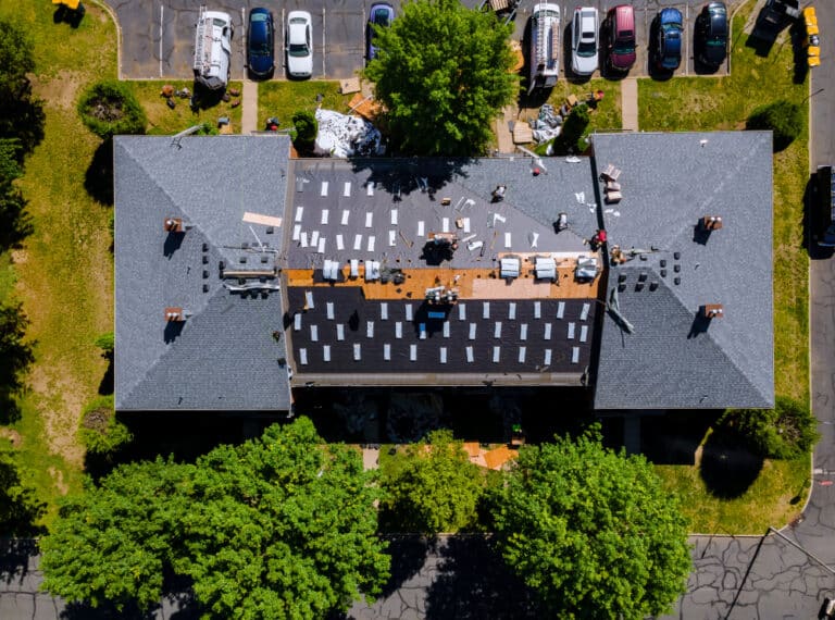 an overhead view of a parking lot with cars parked in it