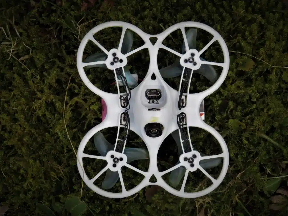 Drone Photography Regulations in Denver 1 Small white FPV drone resting on grass