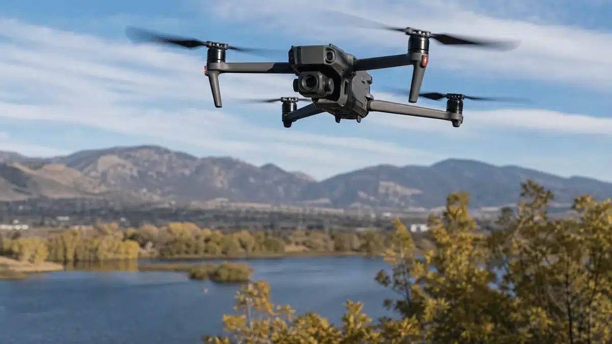 Drone Zones Explained: What Fort Collins Operators Must Know 2 Drone flying over a reservoir with the foothills near Fort Collins